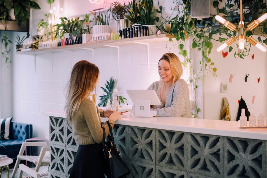 A guest checking in at a front desk